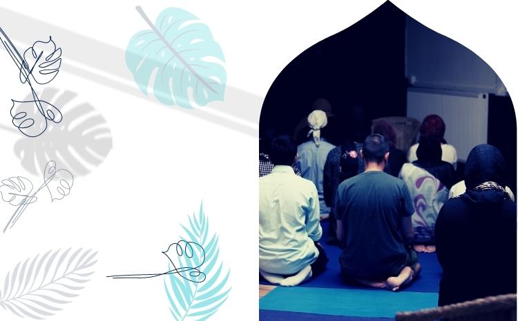 Graphic with a photo to the right of centre, cropped to an arch shape. The photo depicts Muslims of various genders, ages, and backgrounds praying together. The photo is on a light grey background with light blue leaf illustrations overlaid onto the background.